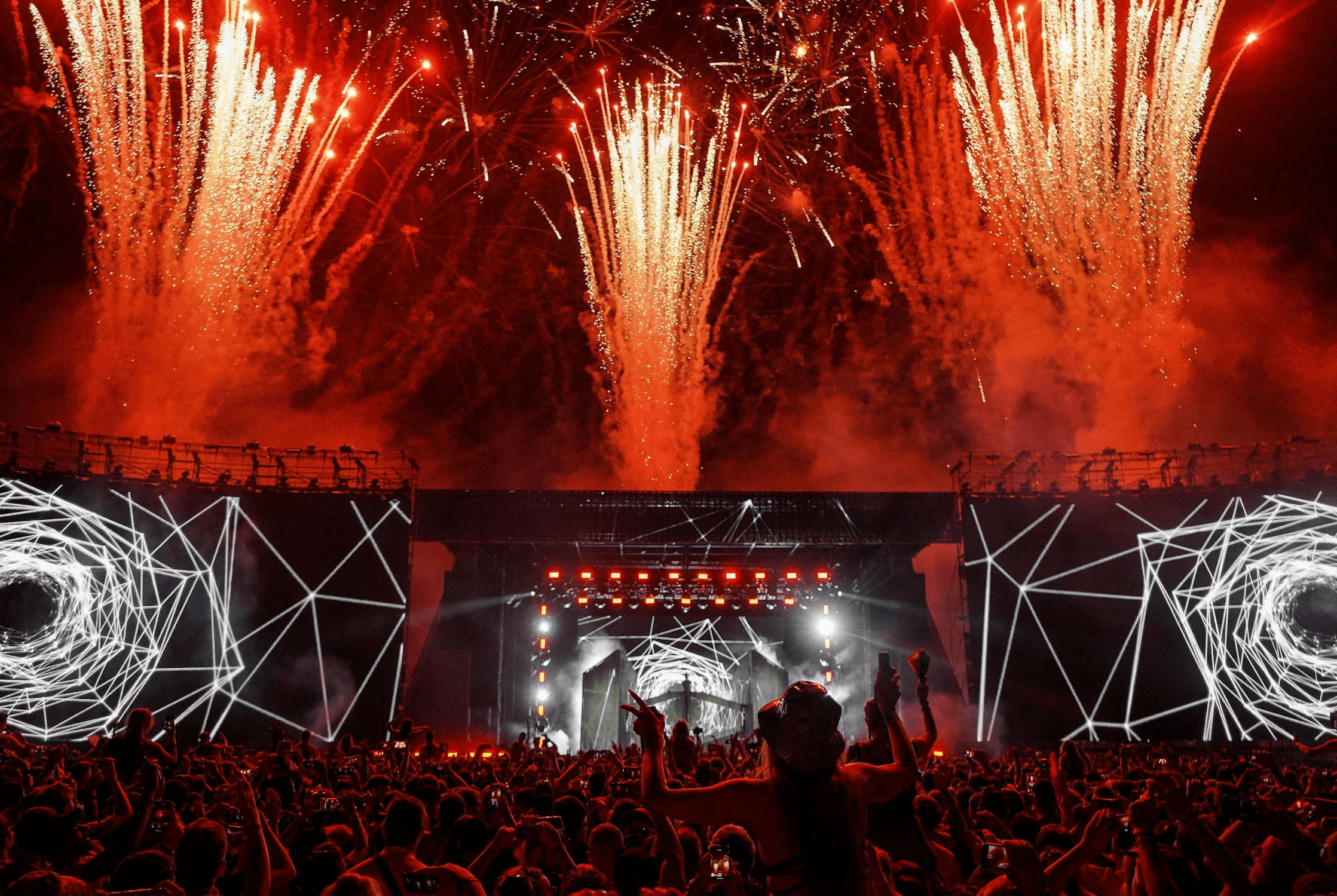 Concert crowd with hands raised